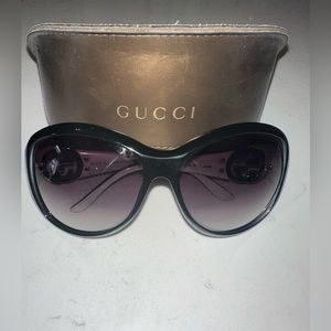 Like New.  Gucci sunglasses with white and silver detail.
